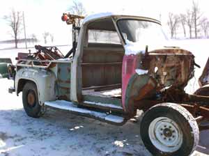 1955 wrecker tow truck front right corner view cab and bed
