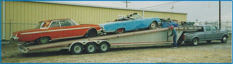 Picture trailer load of restorable cars and parts 