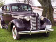 Buick 1938 special straight 8 with suicide 4 door, front view, click for a larger auto pic
